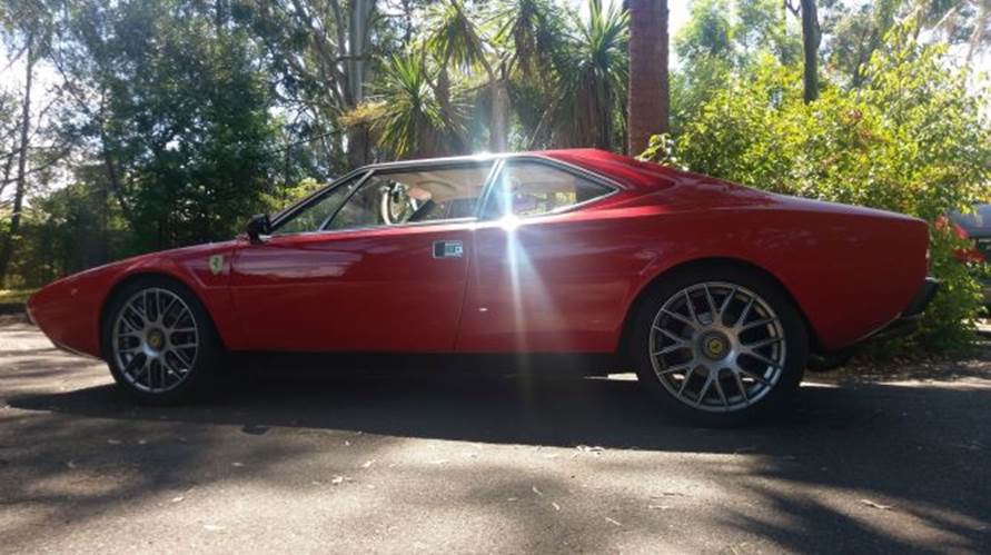 A red sports car

Description automatically generated with medium confidence